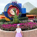 Toddler standing in front of Journey Into Imagination with Figment ride.