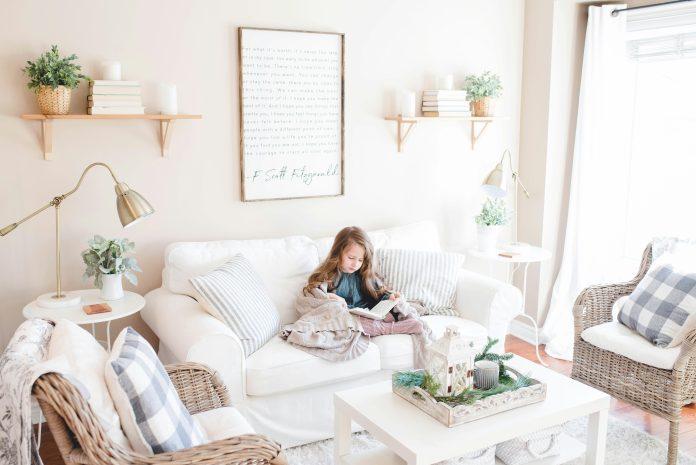 spring children's book little girl reading on couch | spring children's book