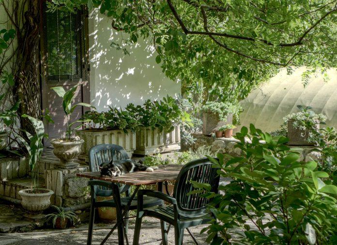 gardening gardening month | photo of a garden with a patio set