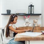 Girl Typing On Computer For Digital Learning | TruFluency Kids Spanish x Latina Mom Collective