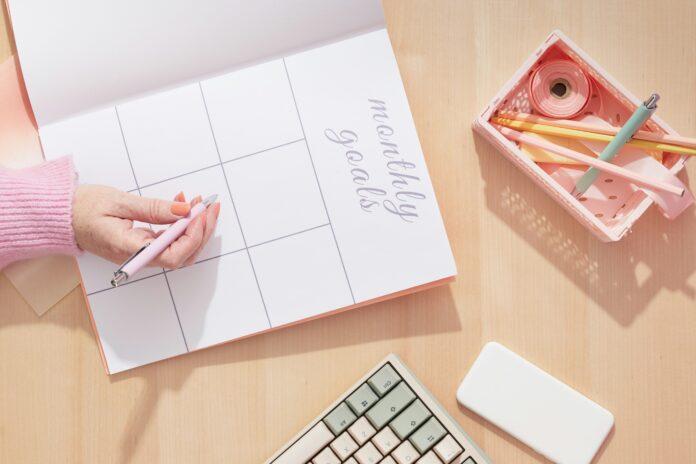 Flat lay of planner with "monthly goals" header | Intentional Mother Daughter Time Ideas