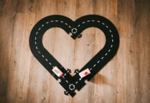 The Language We Leave Behind: Raising Bilingual Children with Tenderness Track of Toy Cars Set Up in Shape of a Heart | Raising Bilingual Kids