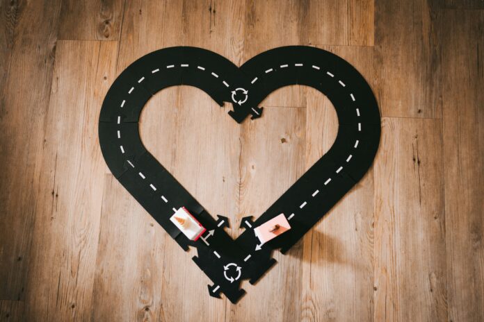 Track of Toy Cars Set Up in Shape of a Heart | Raising Bilingual Kids